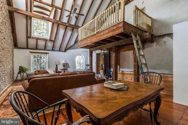 a view of a dining room with furniture and window