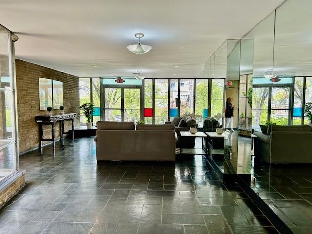 5100 Fifth Avenue, Unit 301 Pittsburgh, PA 15232 - Photo 19 of 25 a living room with furniture and large windows