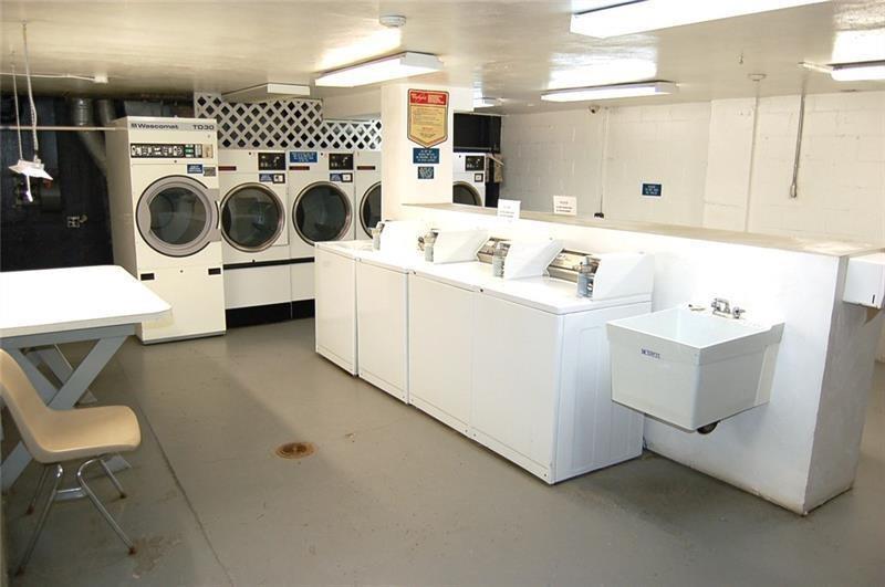 5100 Fifth Avenue, Unit 301 Pittsburgh, PA 15232 - Photo 22 of 25 a utility room with dryer and washer
