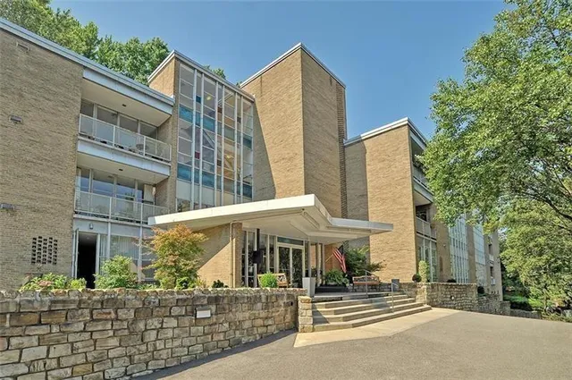 a kitchen with a sink a stove and cabinets