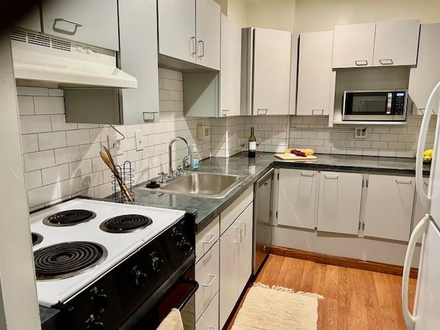 5100 Fifth Avenue, Unit 301 Pittsburgh, PA 15232 - Photo 4 of 25 a kitchen with a sink a stove and cabinets