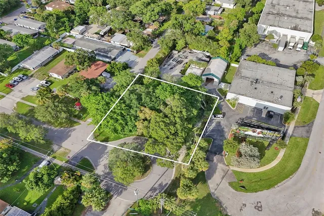 an aerial view of multiple houses with outdoor space