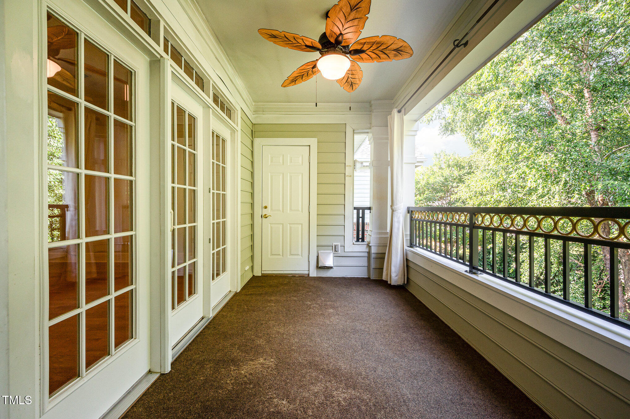 3701 Baron Cooper Pass, Unit 303 Raleigh, NC 27612 - Photo 14 of 19 View from balcony, with privacy and lovely trees