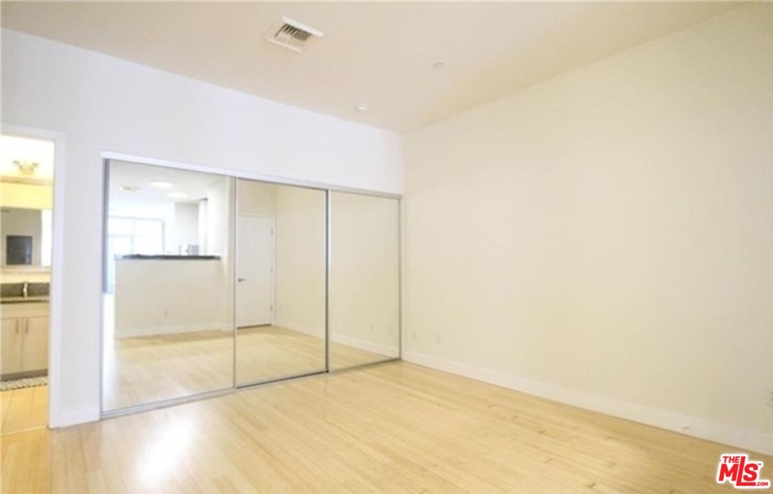 3810 Wilshire Boulevard, Unit 1004 Los Angeles, CA 90010 - Photo 12 of 14 a view of an empty room and window