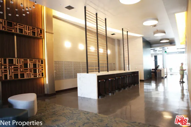a view of a livingroom with furniture and a window