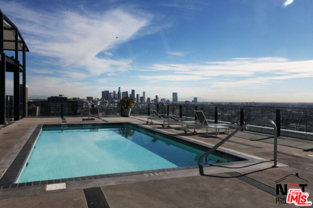 3810 Wilshire Boulevard, Unit 1004 Los Angeles, CA 90010 - Photo 5 of 14 a view of a terrace with chairs
