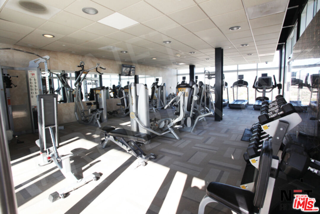 3810 Wilshire Boulevard, Unit 1004 Los Angeles, CA 90010 - Photo 6 of 14 a view of a room with gym equipment