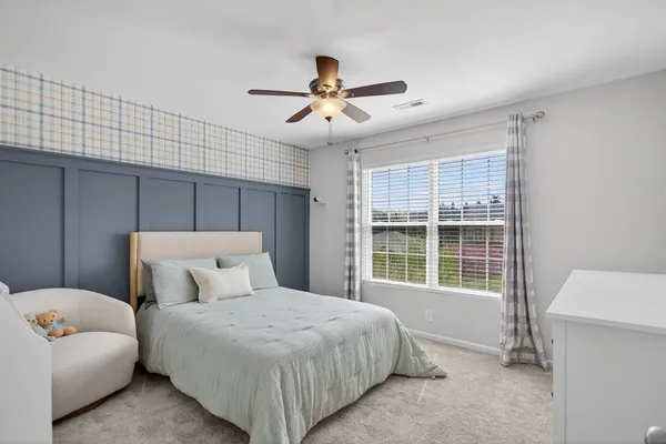 a bedroom with a bed and a cabinets