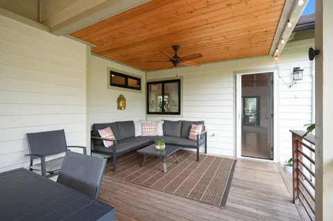 a outdoor living space with furniture and wooden floor