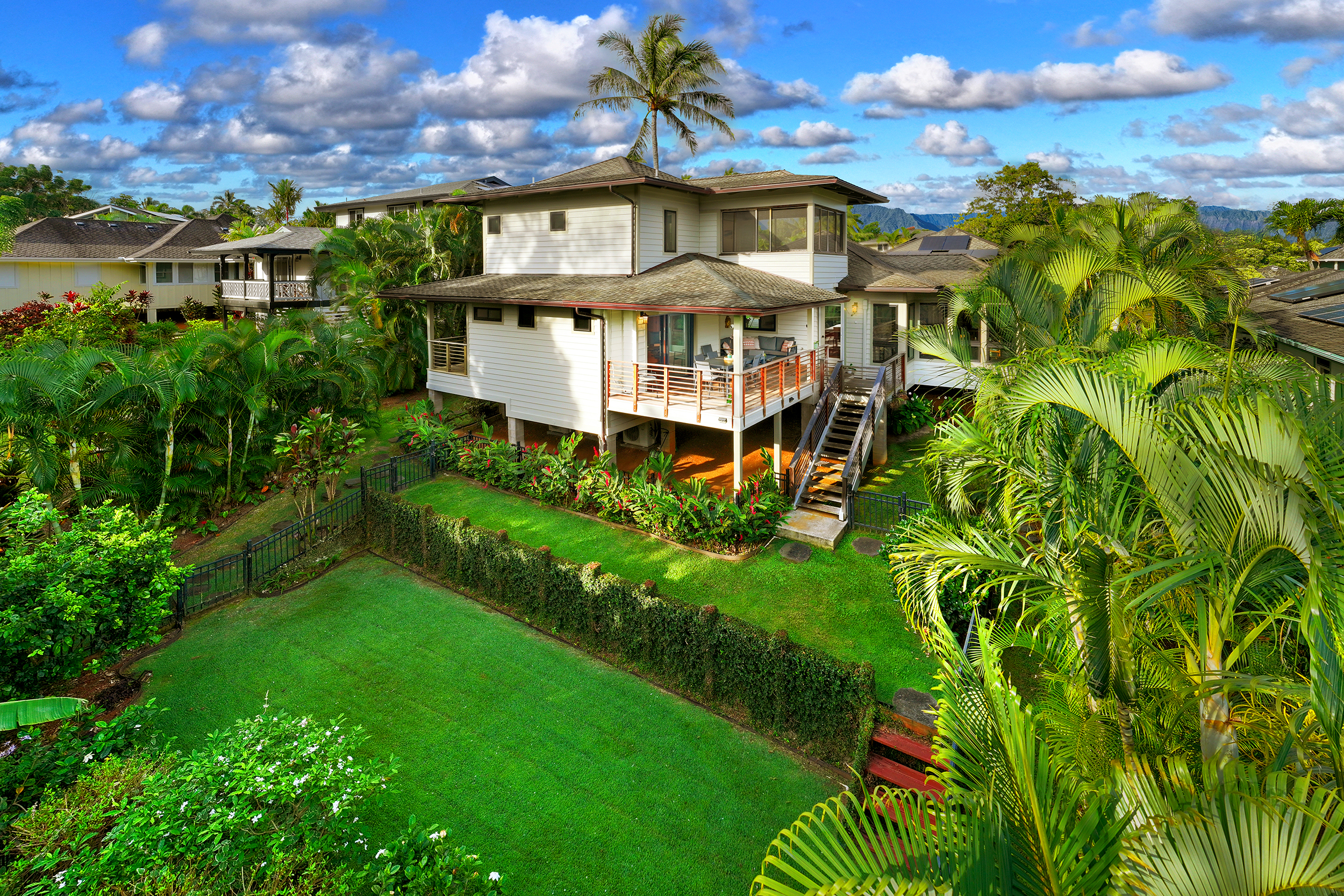 3667 Albert Road Princeville, HI 96722 - Photo 20 of 25 a front view of a house with a garden