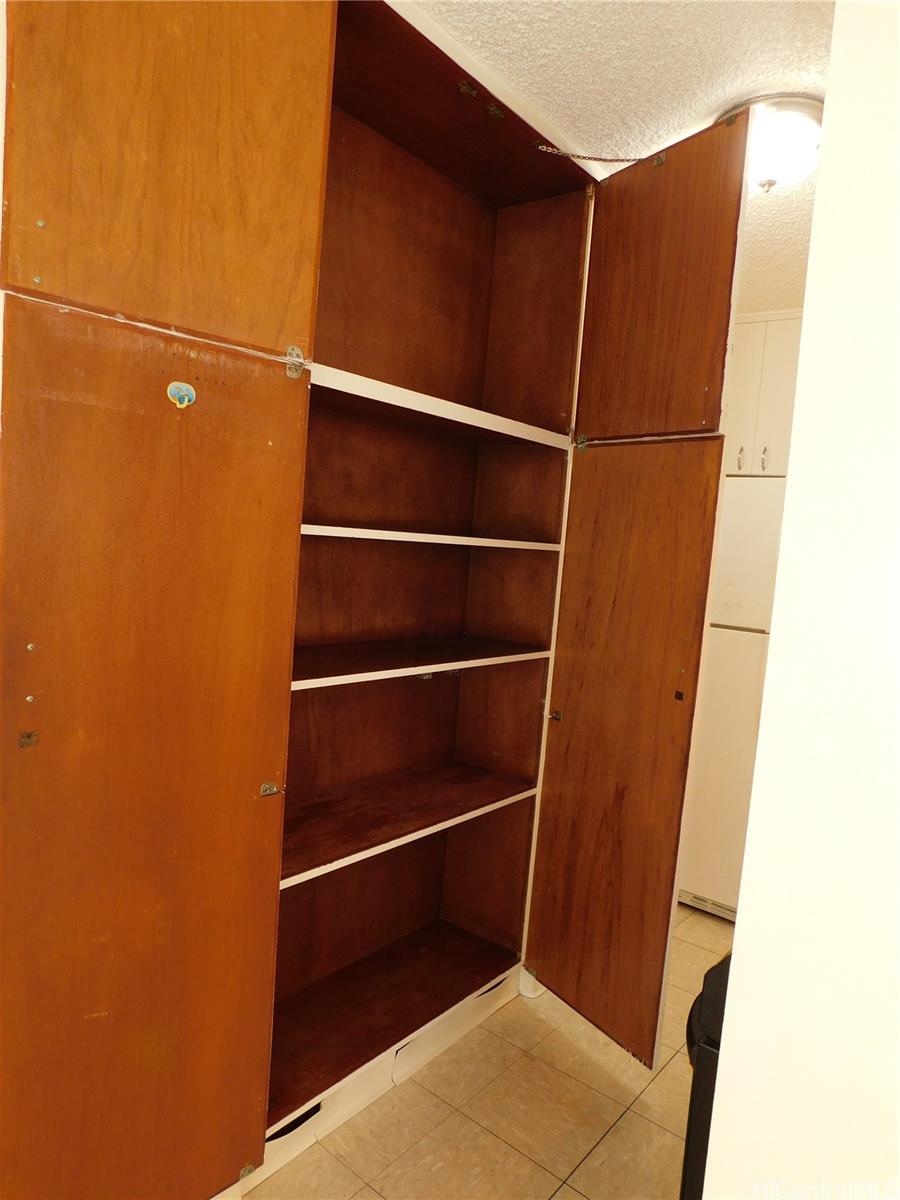 710 Lunalilo Street, Unit 301 Honolulu, HI 96813 - Photo 11 of 21 a view of walk in closet with empty racks