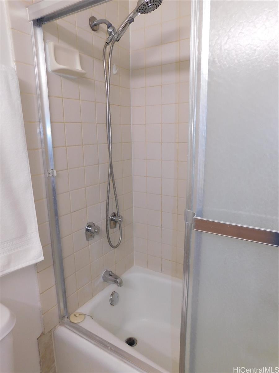 710 Lunalilo Street, Unit 301 Honolulu, HI 96813 - Photo 17 of 21 a bathroom with a bathtub and shower