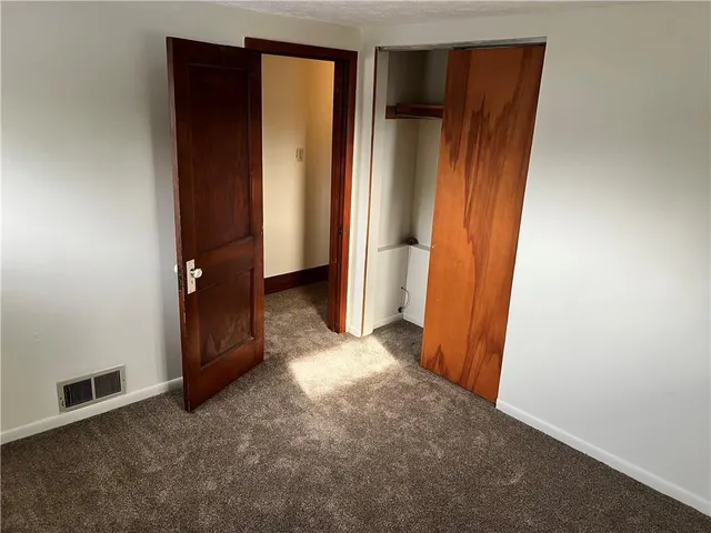 an empty room with closet