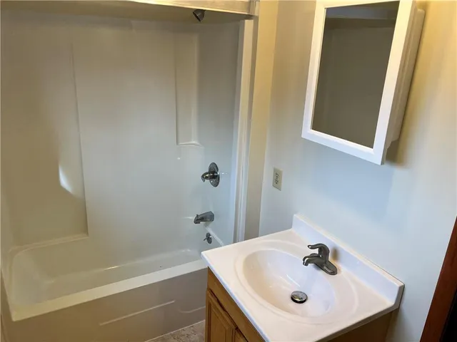 a bathroom with a sink and a bathtub