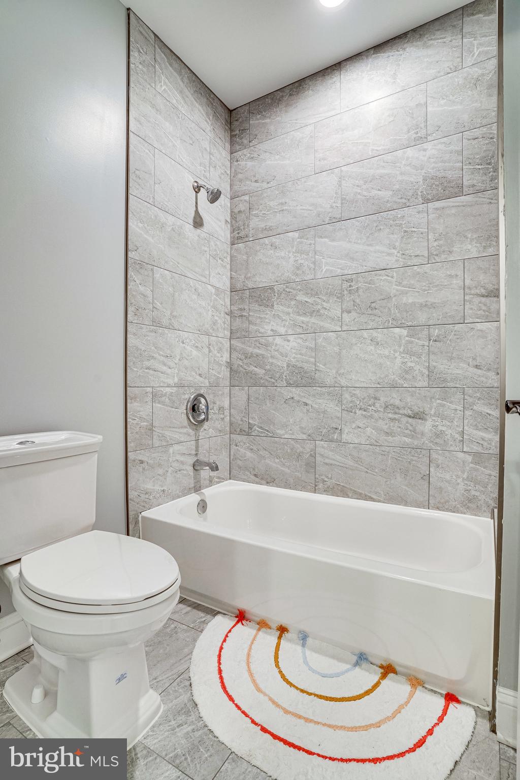 8733 Pohick Road Springfield, VA 22153 - Photo 30 of 40 a bathroom with a toilet and a bathtub
