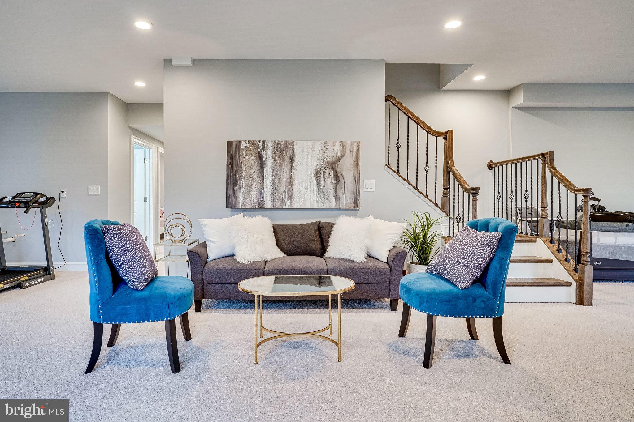 8733 Pohick Road Springfield, VA 22153 - Photo 35 of 40 a living room with furniture and a potted plant