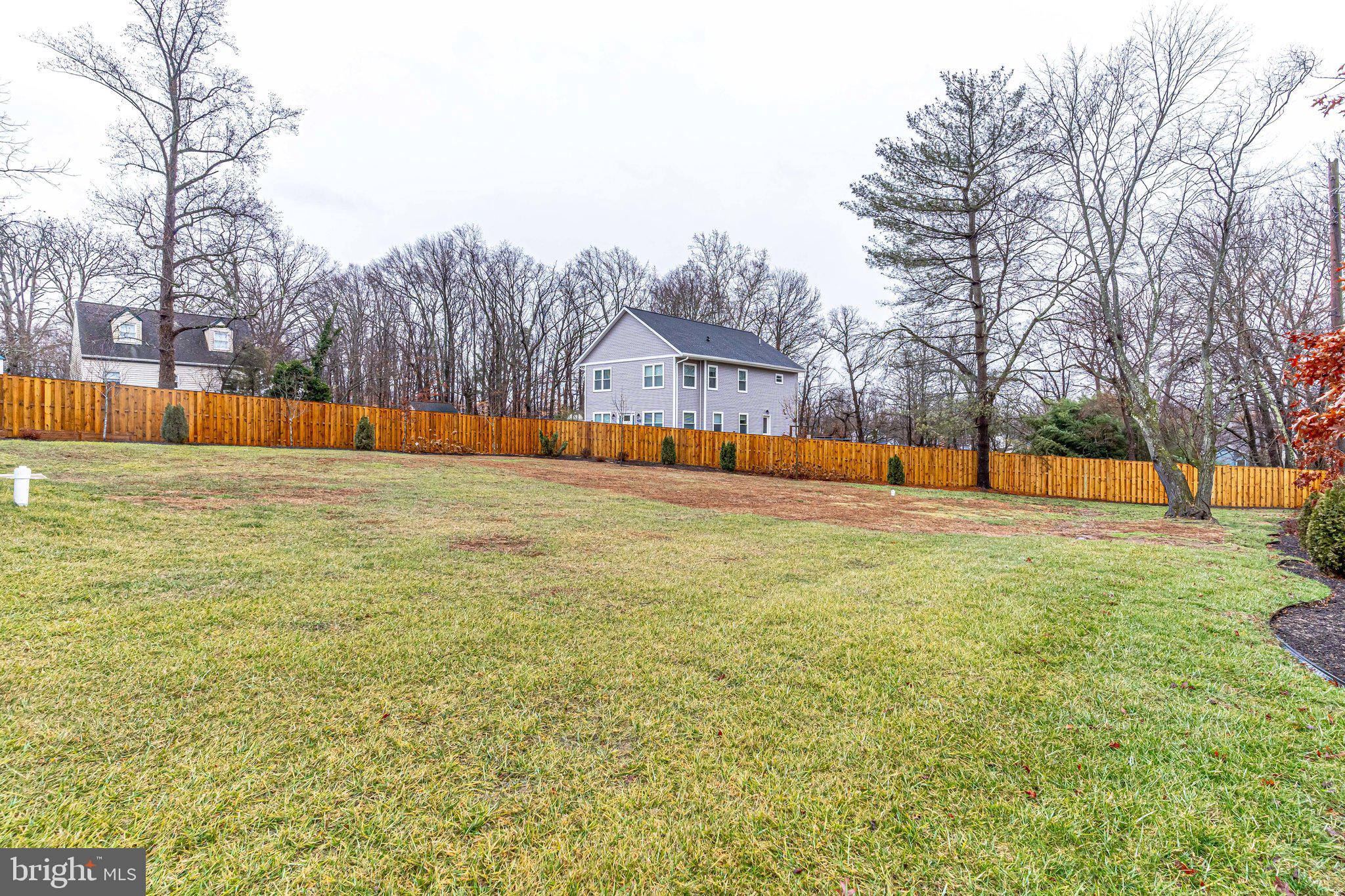 8733 Pohick Road Springfield, VA 22153 - Photo 40 of 40 a view of yard with swimming pool and trees