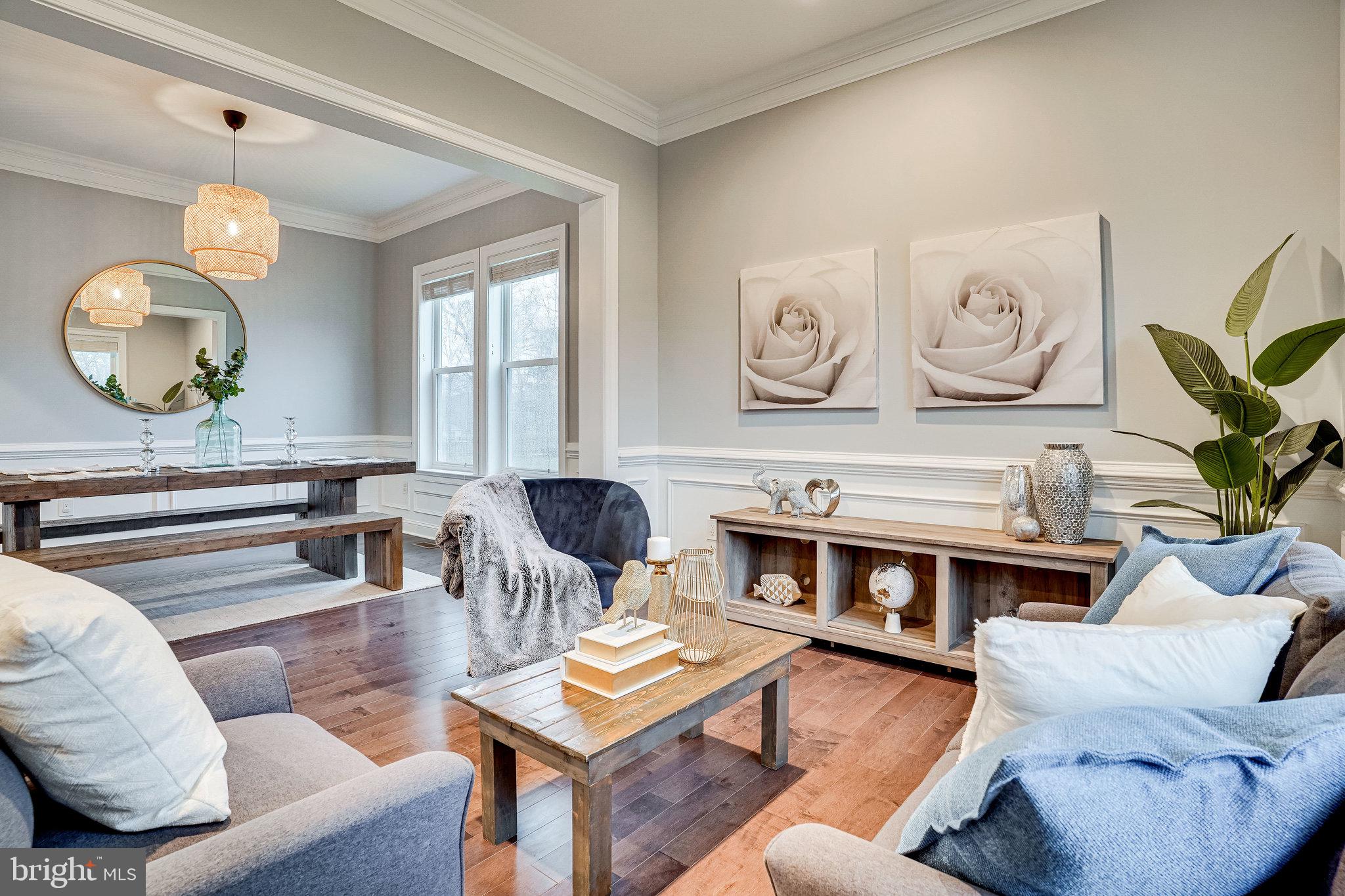 8733 Pohick Road Springfield, VA 22153 - Photo 4 of 40 a living room with furniture kitchen view and a large window