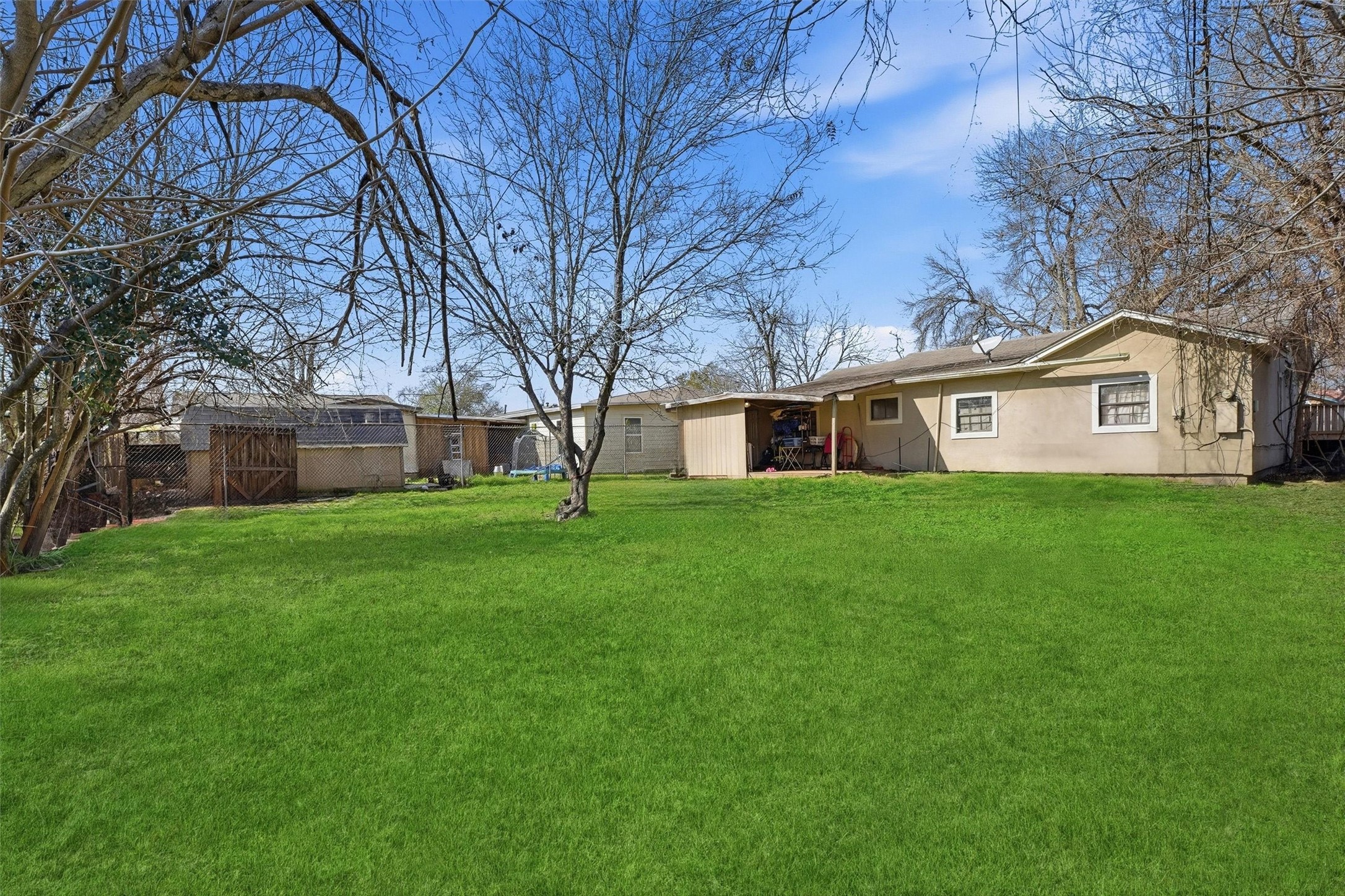 1002 Grenfell Lane Houston, TX 77076 - Photo 25 of 26 a front view of house with yard and green space