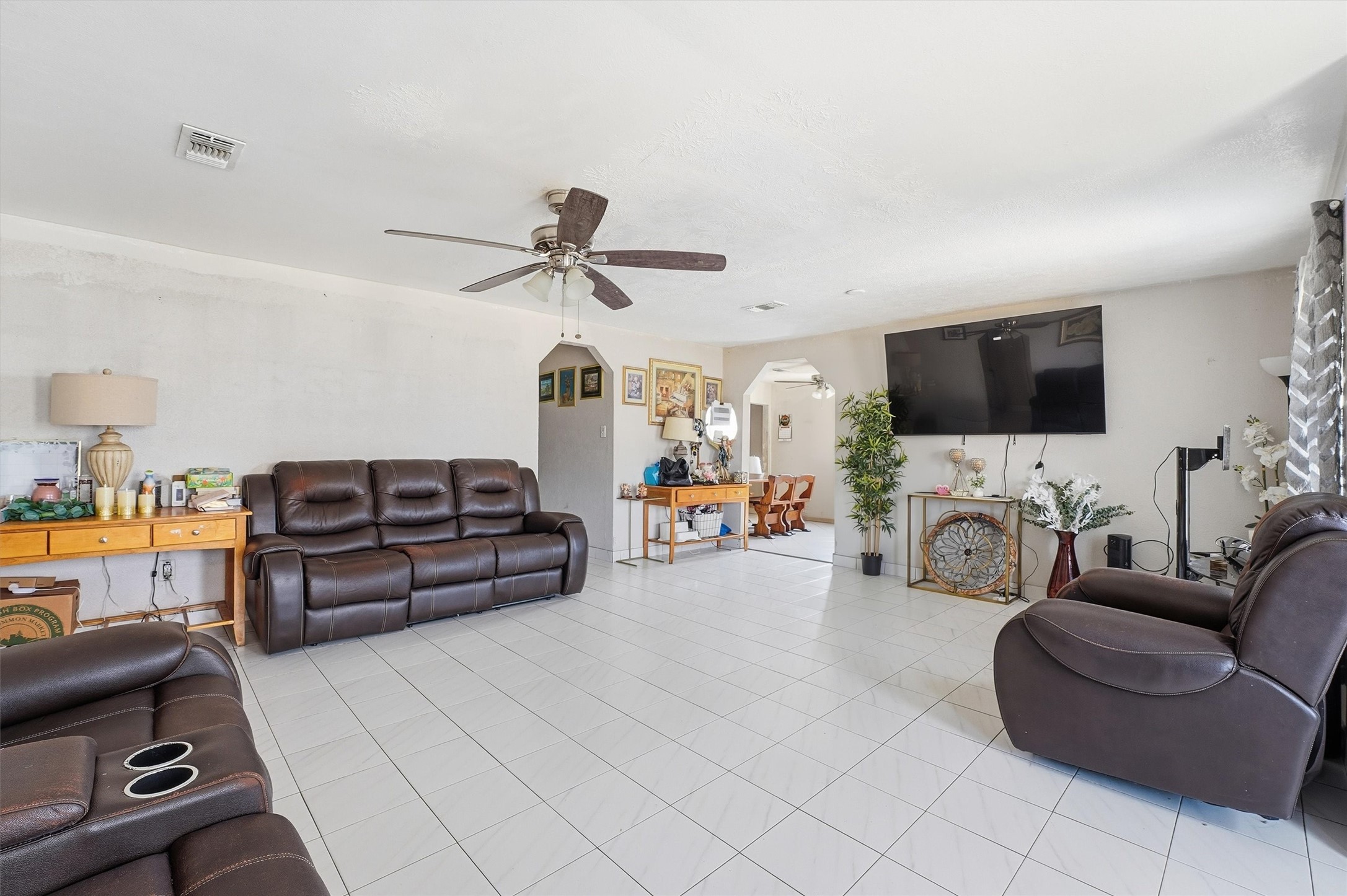 1002 Grenfell Lane Houston, TX 77076 - Photo 4 of 26 a living room with furniture and a flat screen tv