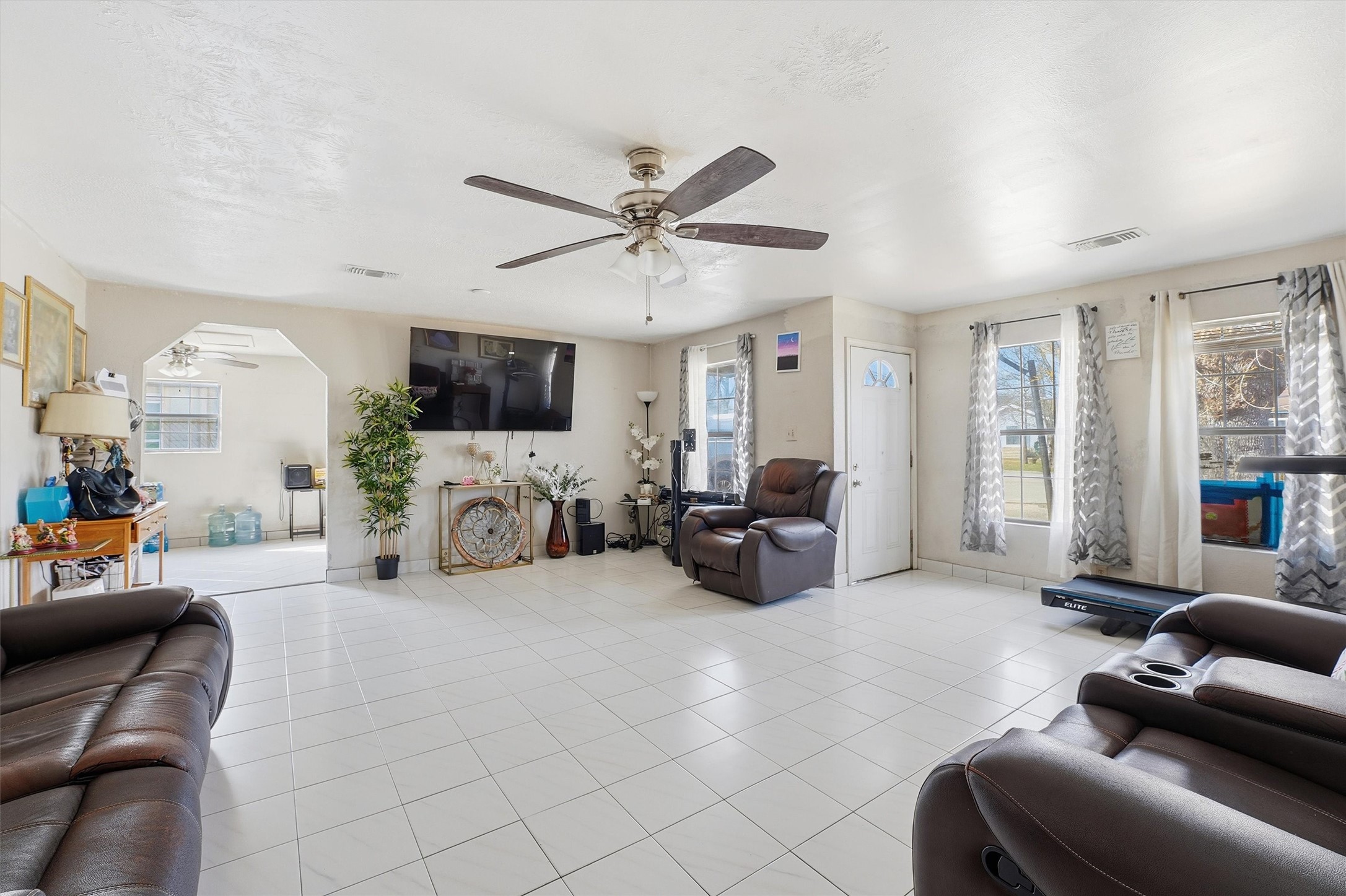 1002 Grenfell Lane Houston, TX 77076 - Photo 5 of 26 a living room with furniture and a large window