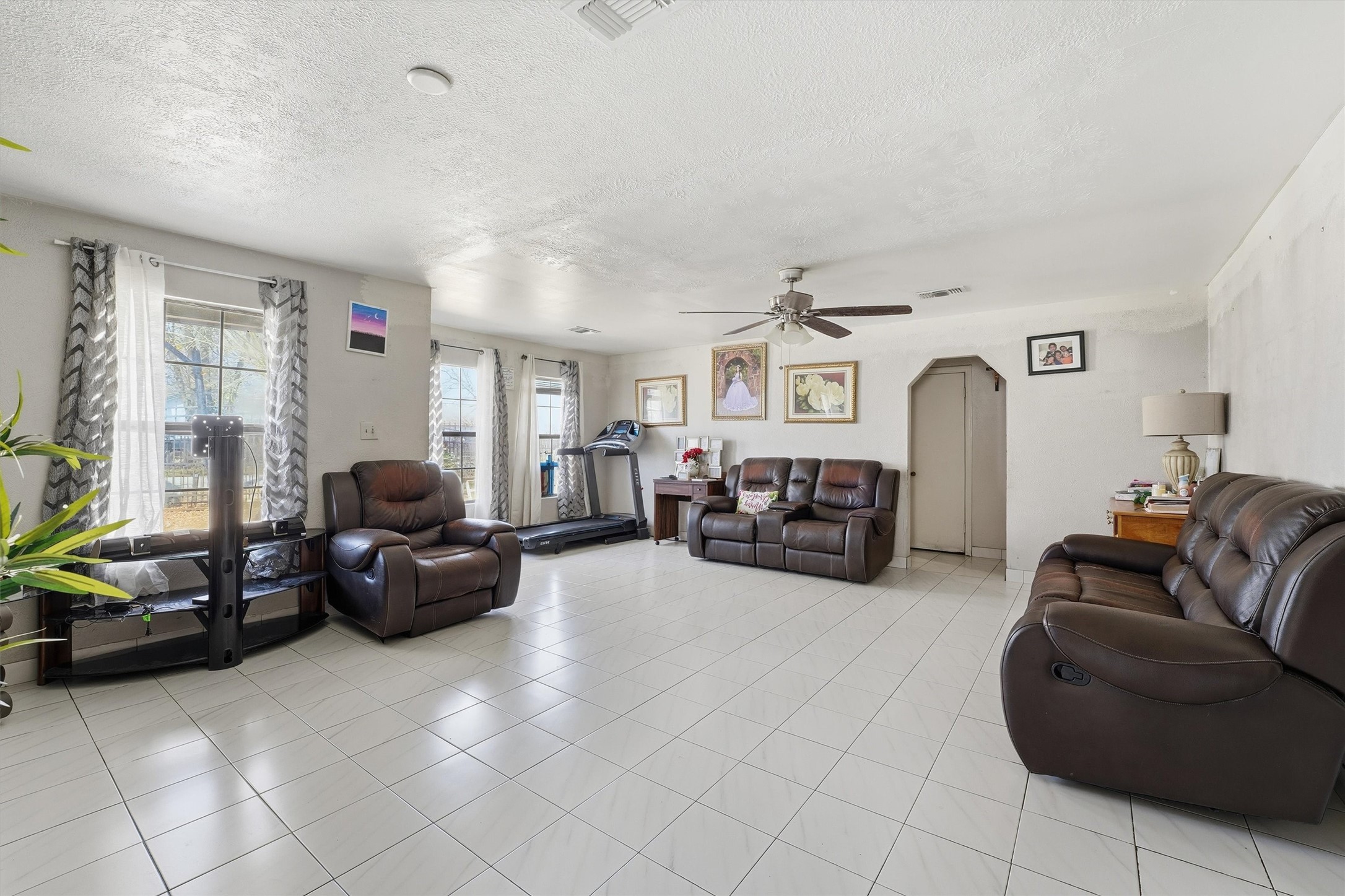 1002 Grenfell Lane Houston, TX 77076 - Photo 6 of 26 a living room with furniture and a large window