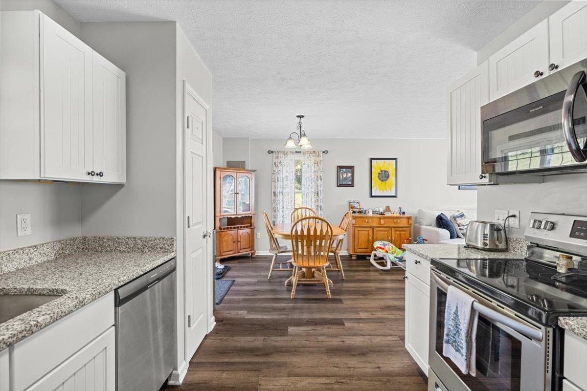 15531 Evergreen Valley Road Timberville, VA 22853 - Photo 11 of 34 a kitchen with stove and cabinets