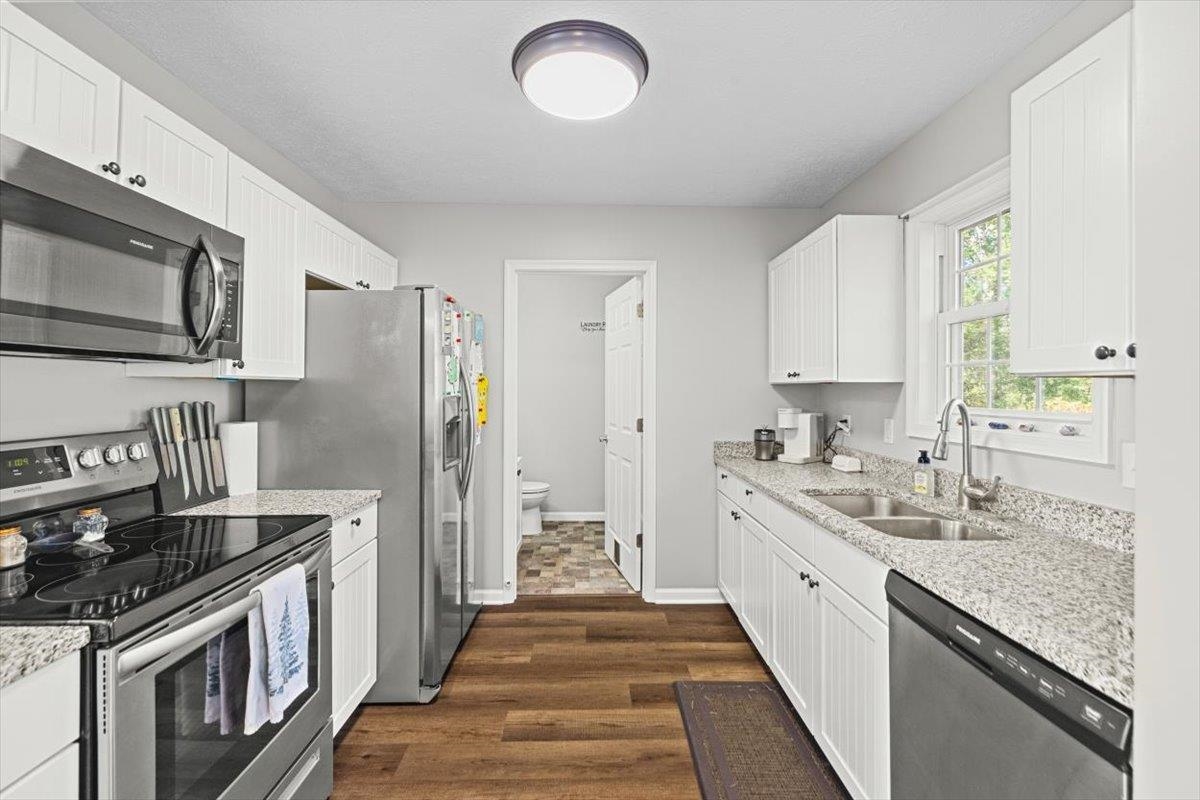 15531 Evergreen Valley Road Timberville, VA 22853 - Photo 12 of 34 a kitchen with stainless steel appliances granite countertop a sink stove and refrigerator