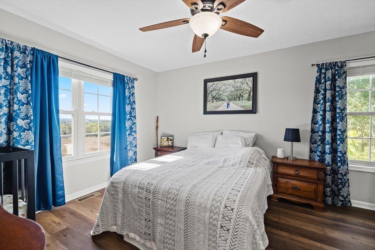 15531 Evergreen Valley Road Timberville, VA 22853 - Photo 14 of 34 a bedroom with a bed and a chandelier