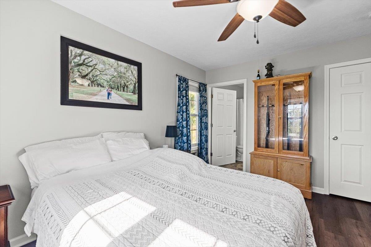 15531 Evergreen Valley Road Timberville, VA 22853 - Photo 16 of 34 a bedroom with a large bed and a chandelier