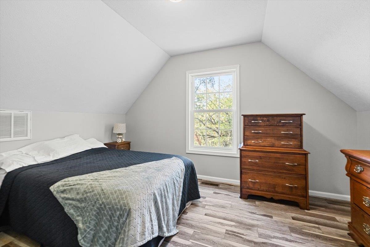 15531 Evergreen Valley Road Timberville, VA 22853 - Photo 19 of 34 a bedroom with a bed and a dresser