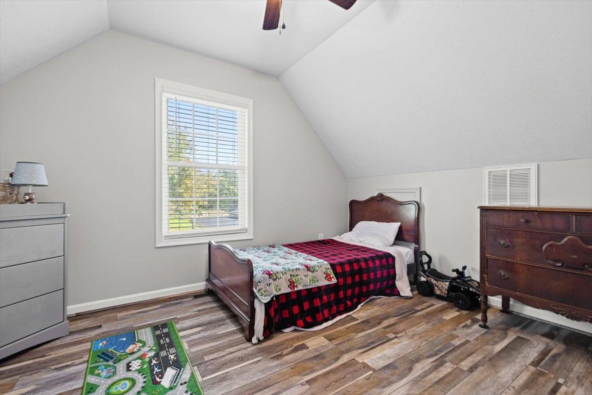 15531 Evergreen Valley Road Timberville, VA 22853 - Photo 21 of 34 a bedroom with a bed and a dresser