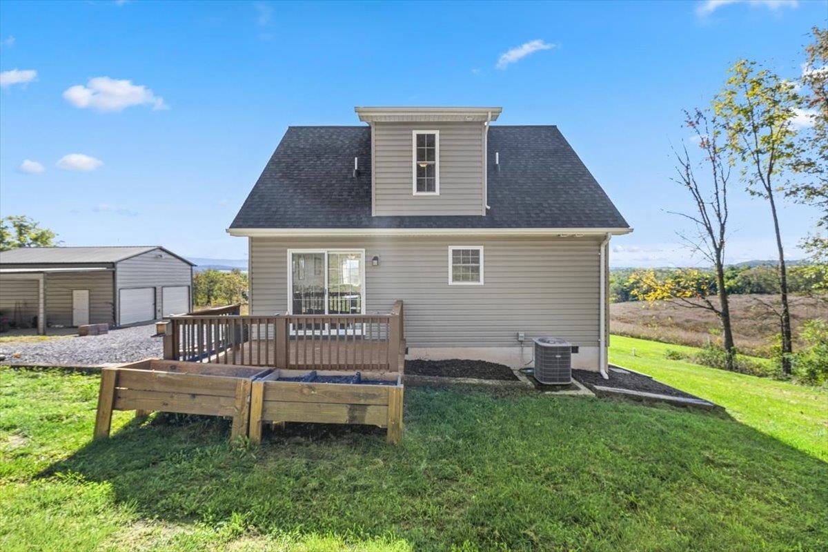 15531 Evergreen Valley Road Timberville, VA 22853 - Photo 22 of 34 a front view of a house with garden