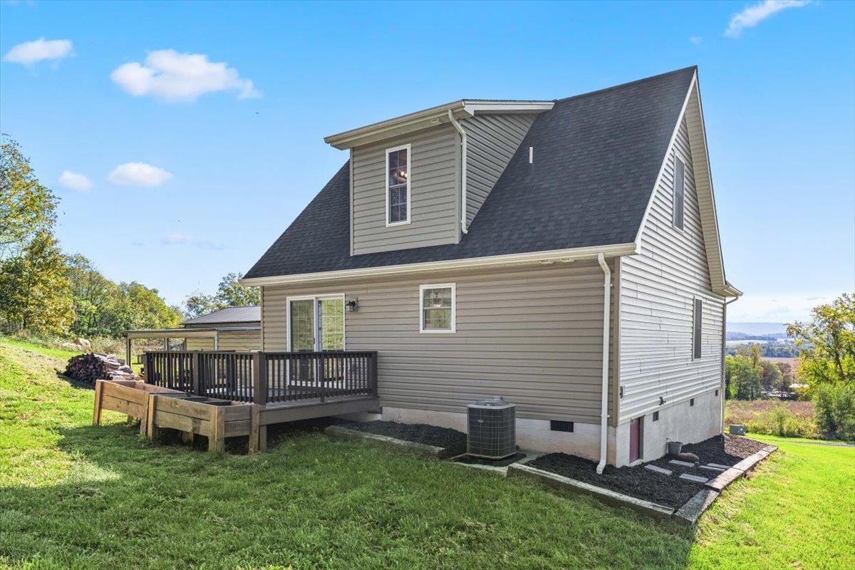 15531 Evergreen Valley Road Timberville, VA 22853 - Photo 23 of 34 a view of a house with a yard and deck
