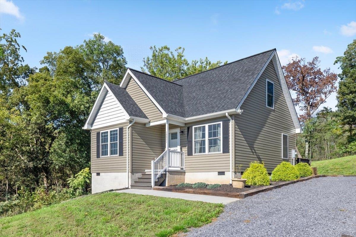 15531 Evergreen Valley Road Timberville, VA 22853 - Photo 29 of 34 a front view of a house with a yard and garage