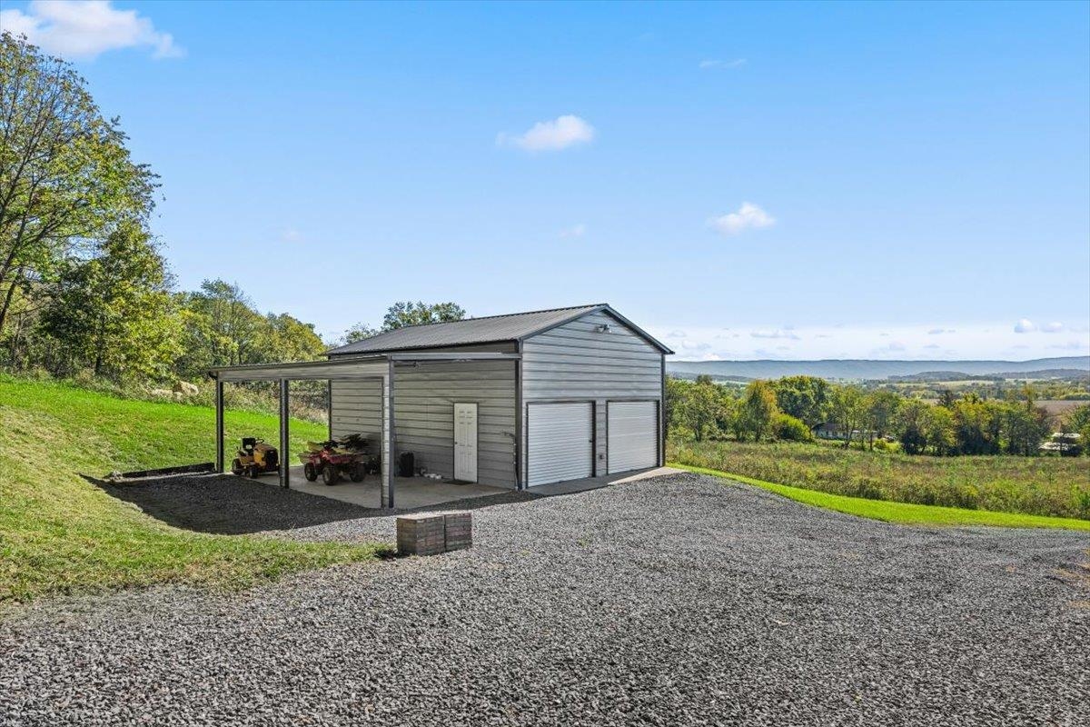 15531 Evergreen Valley Road Timberville, VA 22853 - Photo 5 of 34 a view of a house with backyard and sitting area