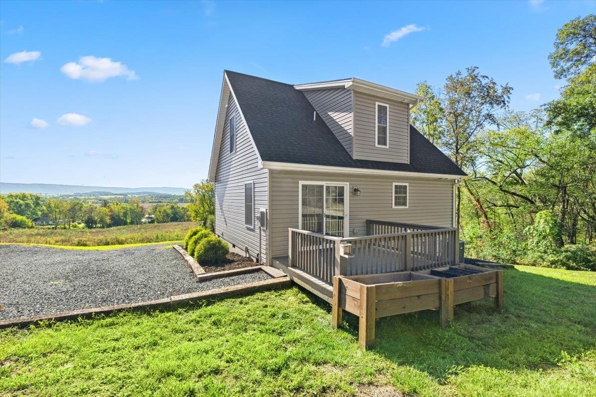 15531 Evergreen Valley Road Timberville, VA 22853 - Photo 6 of 34 a view of a house with a yard