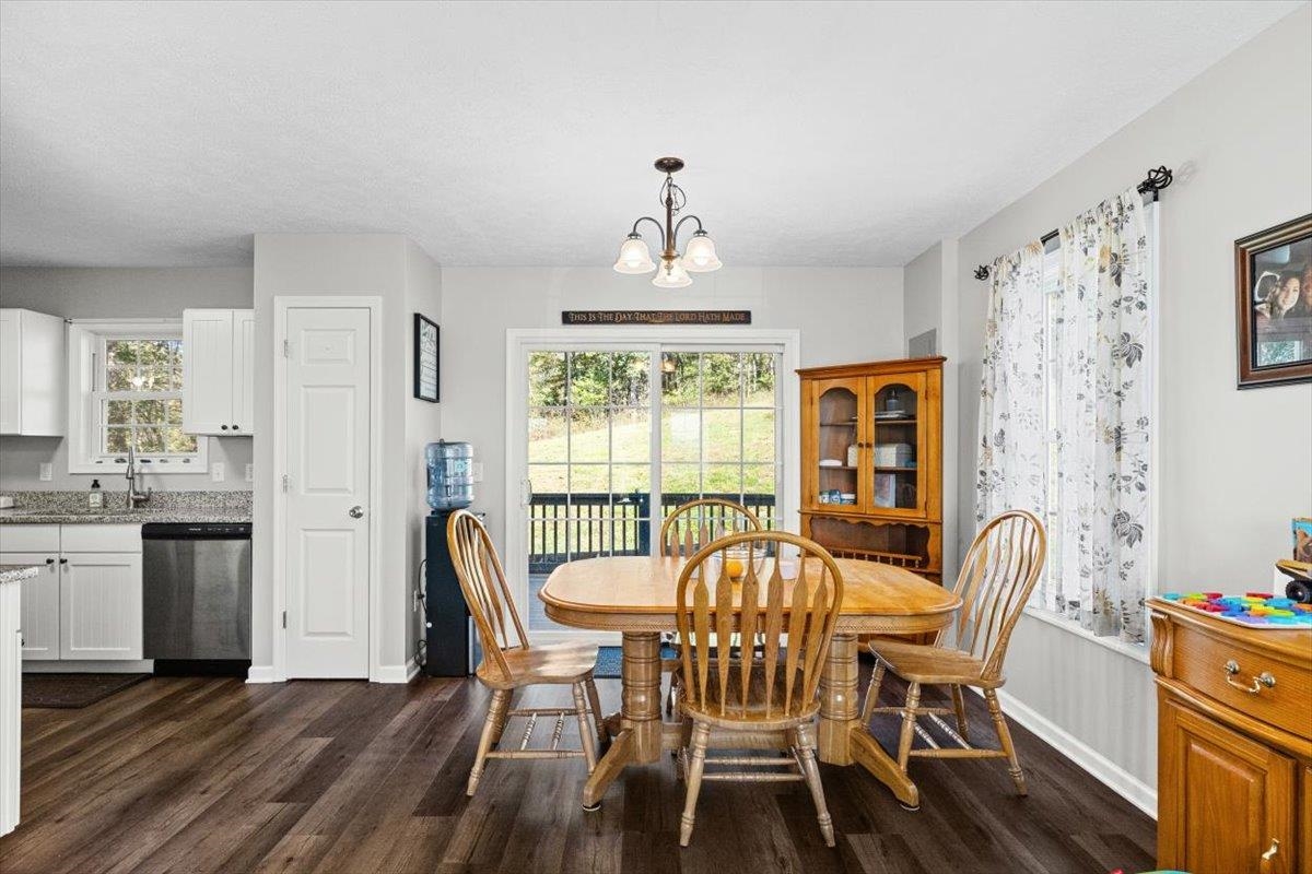 15531 Evergreen Valley Road Timberville, VA 22853 - Photo 9 of 34 a view of a dining room with furniture window and wooden floor