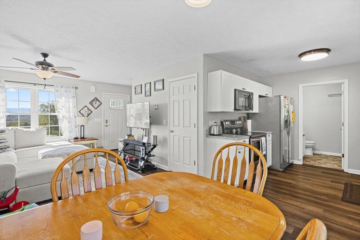 15531 Evergreen Valley Road Timberville, VA 22853 - Photo 10 of 34 a view of a dining room with furniture and a chandelier
