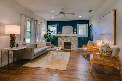 a living room with furniture and a fireplace