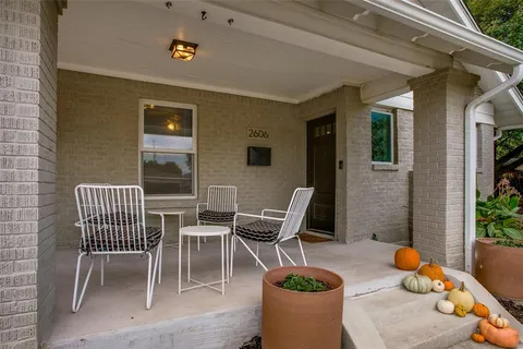 a view of a patio with couple of chairs