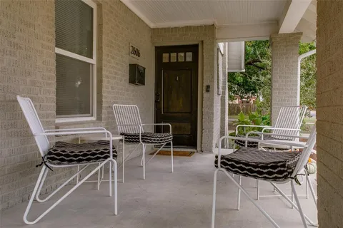 a outdoor dining space with furniture and a potted plant