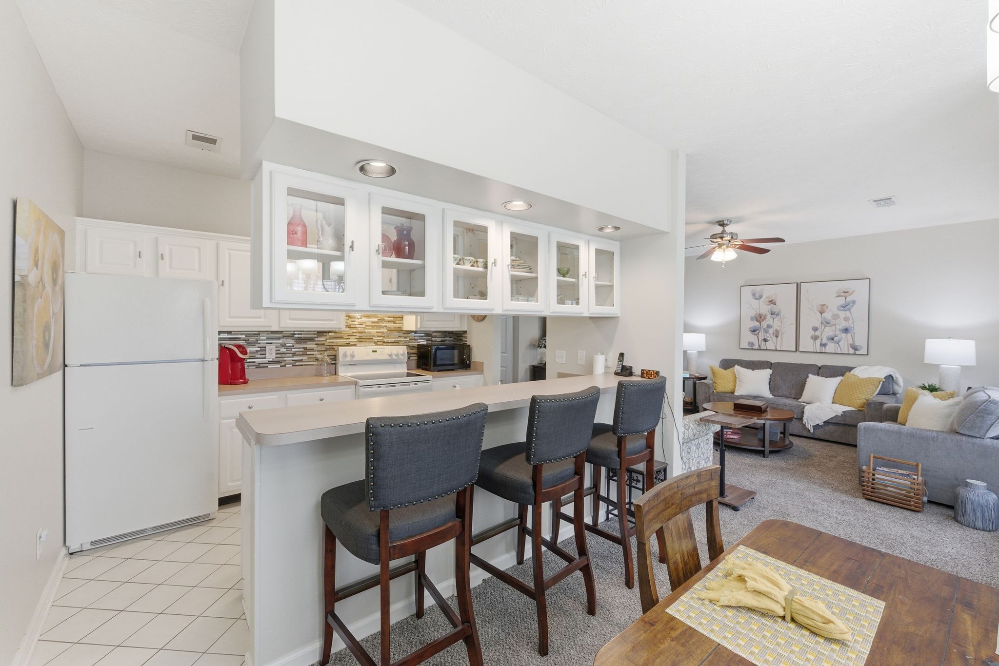 609 Churchill Crossing Madison, TN 37115 - Photo 11 of 26 a kitchen with stainless steel appliances refrigerator dining table and chairs