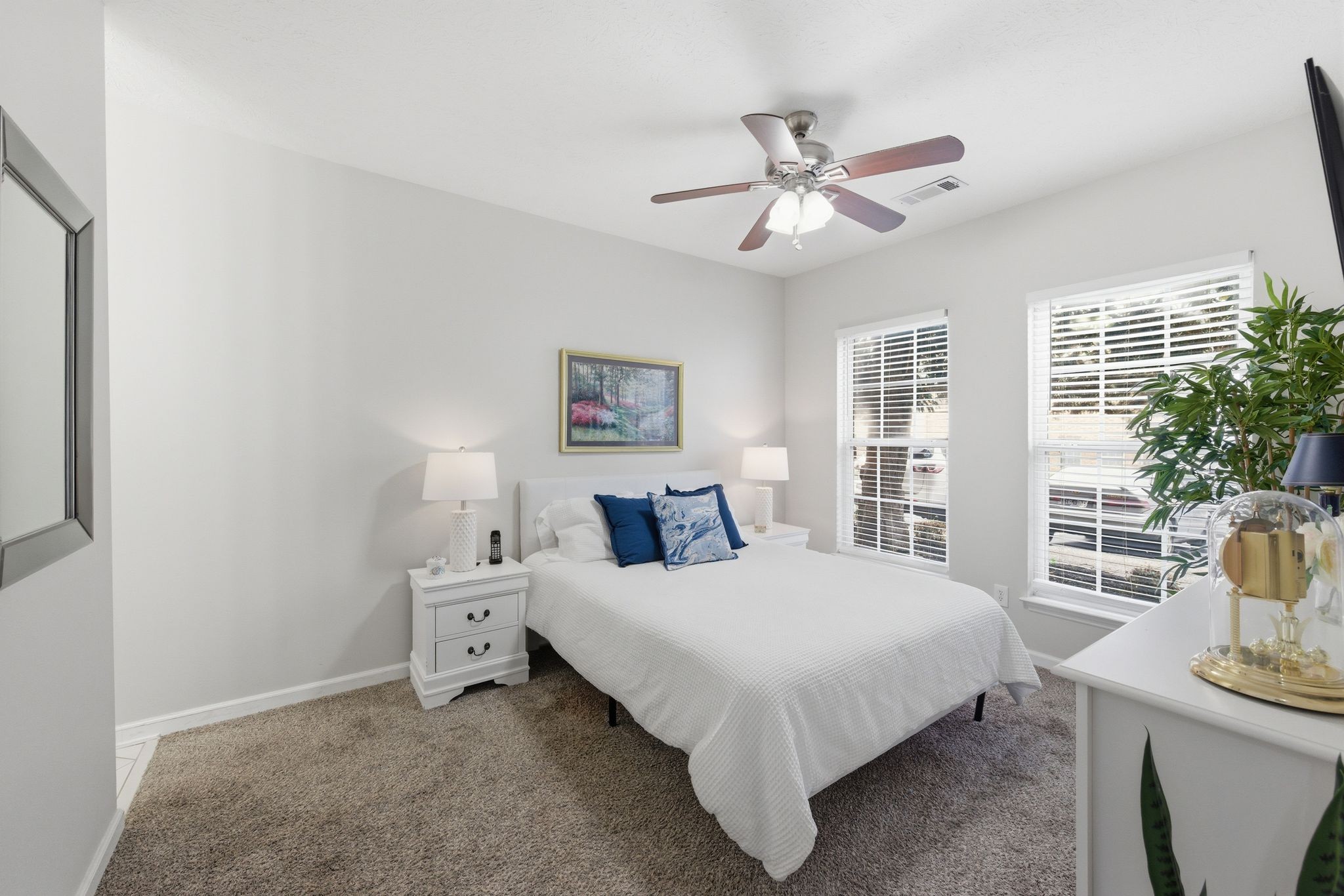 609 Churchill Crossing Madison, TN 37115 - Photo 20 of 26 a bedroom with a bed and a chandelier