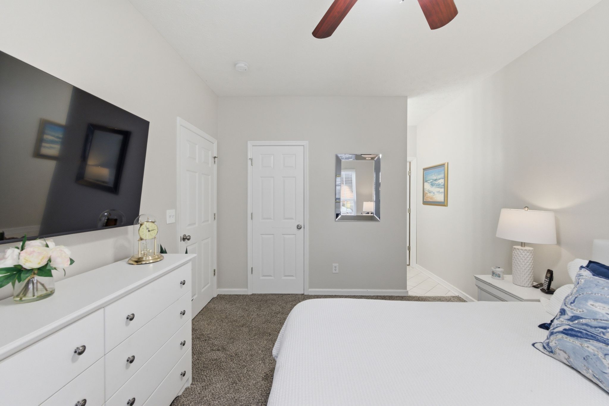 609 Churchill Crossing Madison, TN 37115 - Photo 21 of 26 a bedroom with a bed and a flat tv screen on dresser