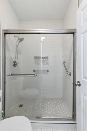 a bathroom with a shower and toilet