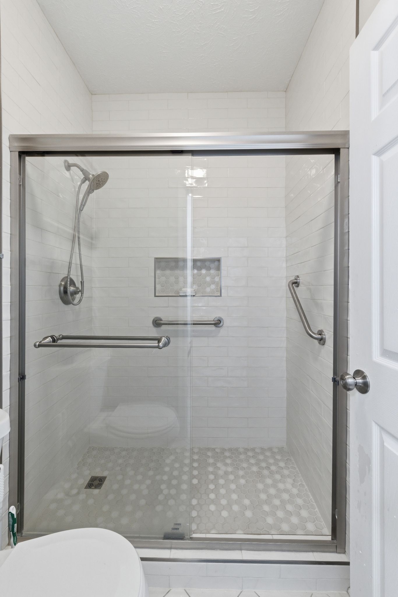 609 Churchill Crossing Madison, TN 37115 - Photo 23 of 26 a bathroom with a shower and toilet