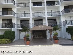 a front view of a building with garden
