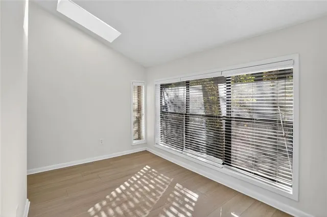 a view of an empty room with a window