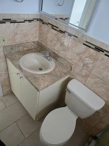 a bathroom with a toilet and a sink